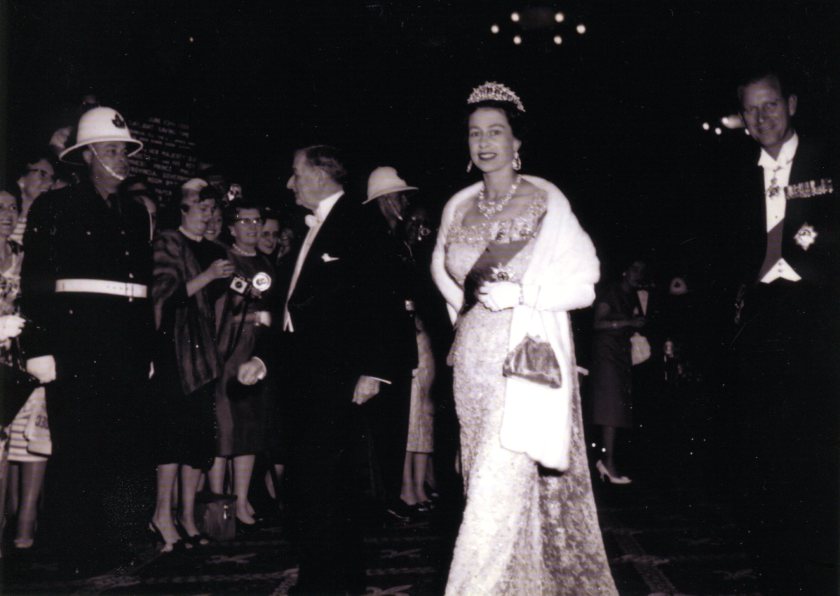 1959 Queen Elizabeth and Price Phillip at Chateau Frontenac (notice ADPi with diamond- shaped nametag in background)